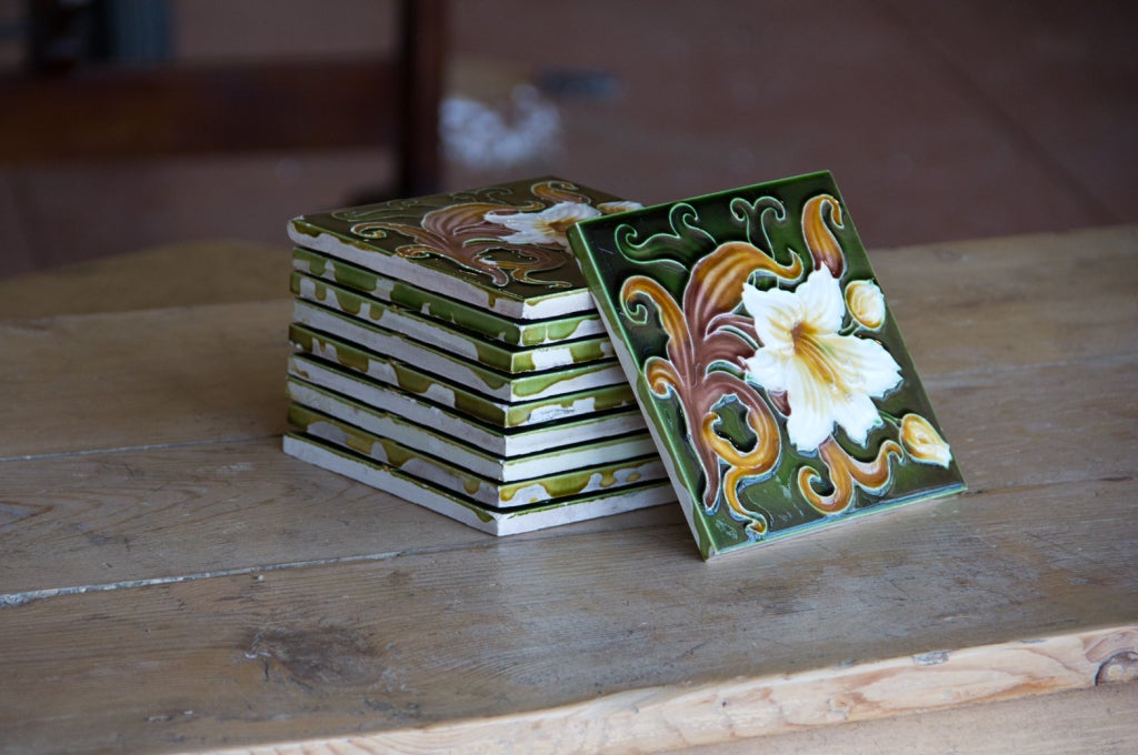 Lovely set of 10 original Art Nouveau tiles by Henry Richards Boote of Tunstall, Staffordshire, England. The distinguishable impressed mark of a Richards England visible on the back of the tiles. These tube lined tiles have a strong dark green