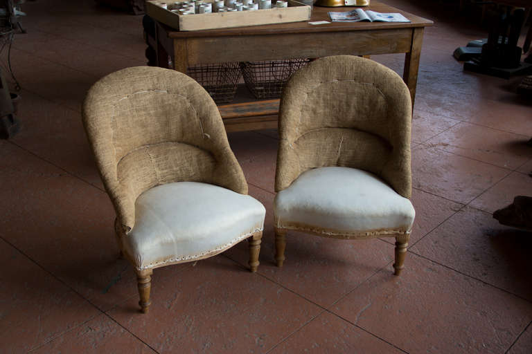 Pair vintage French ladies tub chairs with their original stuffing and the back has been recovered in hessian. Lovely front turned legs.