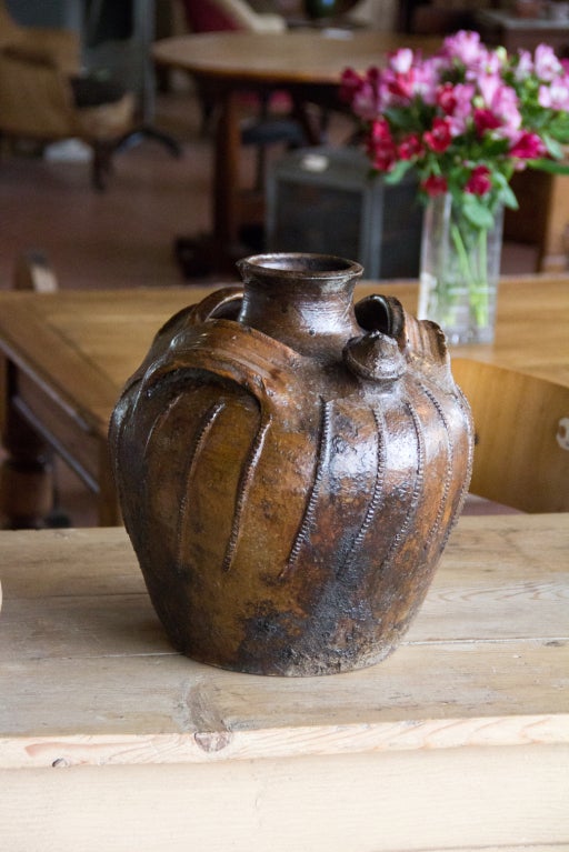 Rare French 18th century glazed pottery nut oil jar, from the Ardèche in France. Wonderful color.