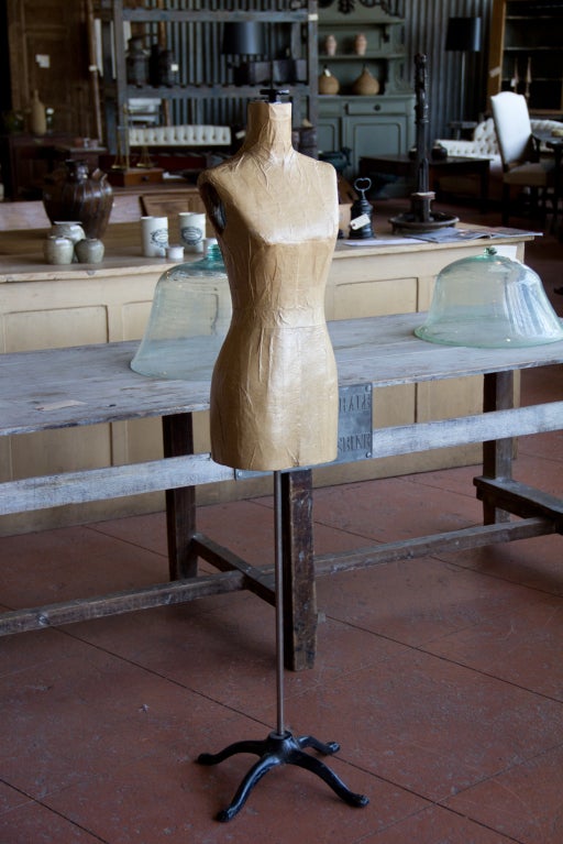 Vintage petite adjustable mannequin with splayed iron base found in the US.