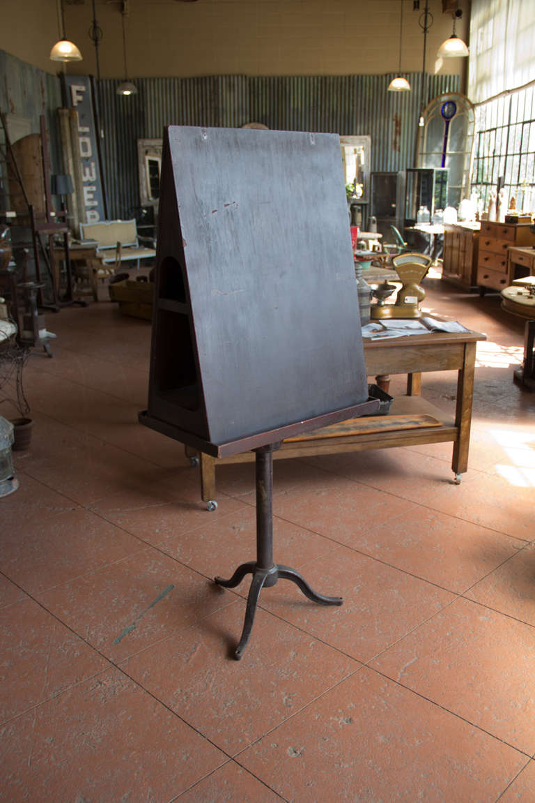 Rare and unusual antique Arts & Crafts double sided wooden art easel on decorative iron splayed tripod base.