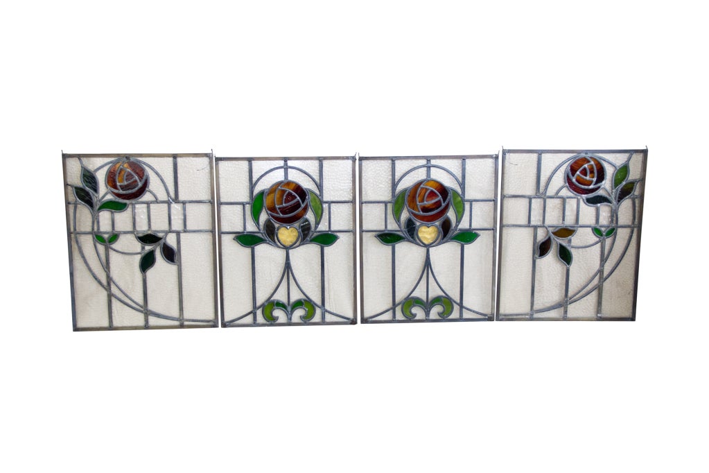 Beautiful set of 4 English Art Nouveau leaded windows in the style of Charles Renee Mackintosh. The windows could quite easily be split up and used separately.