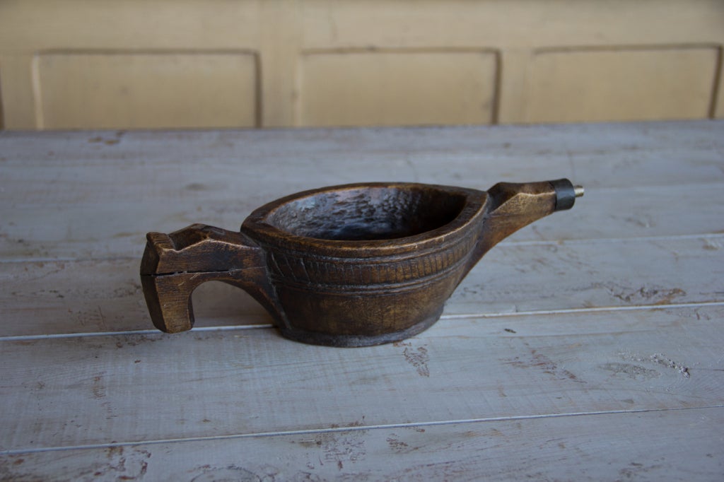 Pair of antique opium kharal bowls from Rajasthan, India. Each one is finely carved from one piece of wood.  Wonderful aged patina on both bowls.