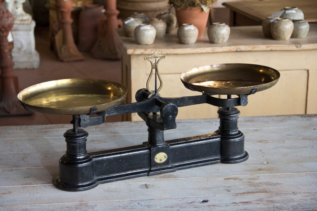 Large antique cast iron French balance scale with 2 brass pans.  The scale is from Usine de Graffenstaden, in the Starsbourg area of France.