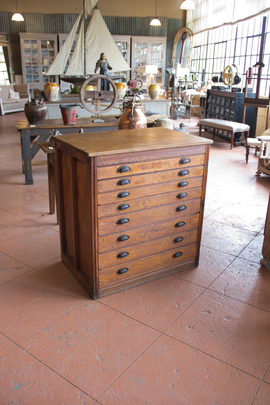 Antique English oak eight-drawer fielded paneled planner's chest with original Gaslon pulls. The top is pine.