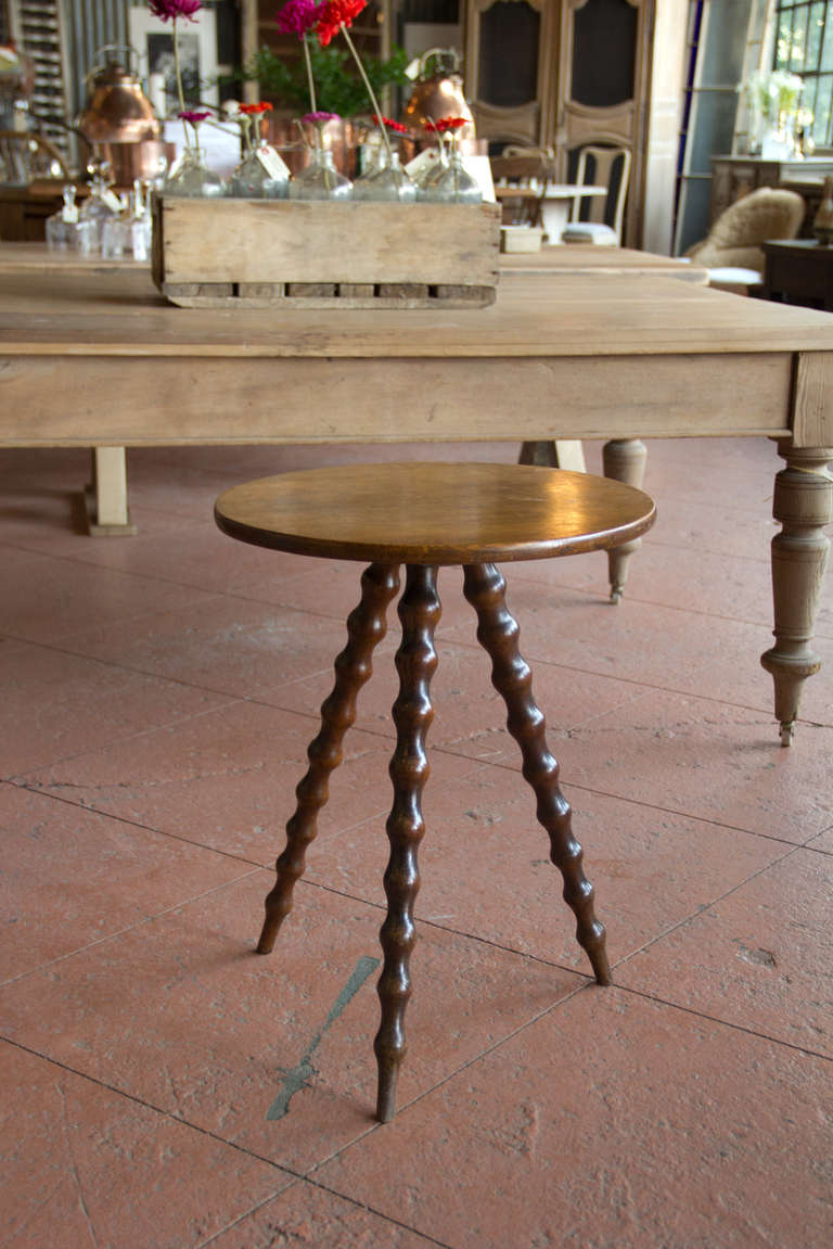 Antique English oak cricket table with barley twist legs.