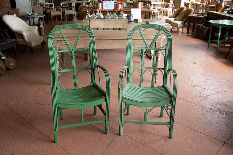 Near pair of wonderful vintage French conservatory chairs with their original green paint.