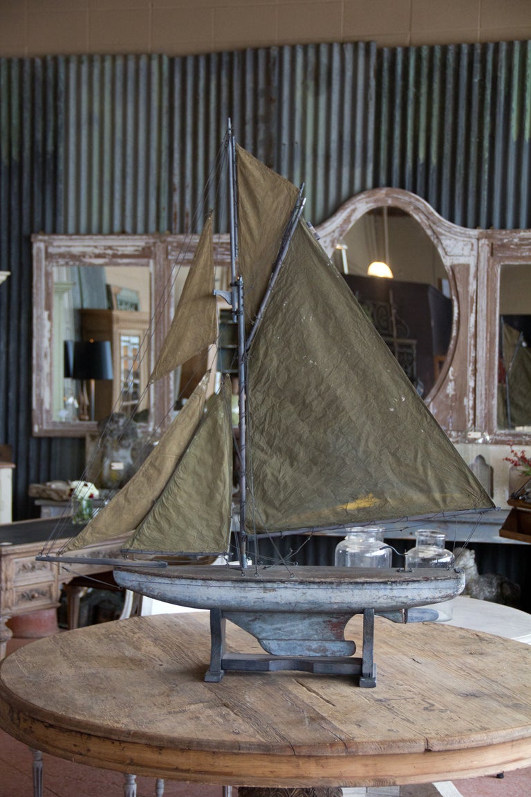 Large 19th C  English antique pond yacht still with its original blue paint finish. The rigging and the stand were added later. This is a beautiful decorative item. From Clitheroe, UK