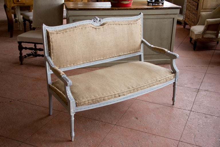 Beautiful antique Louis XVI style settee with its original stuffing and covered in new hessian. The settee has been repainted.