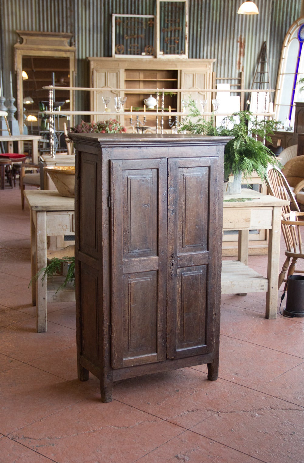 Antique petite oak armoire, with paneled front and sides on stile feet.  Wonderfully gnarly.