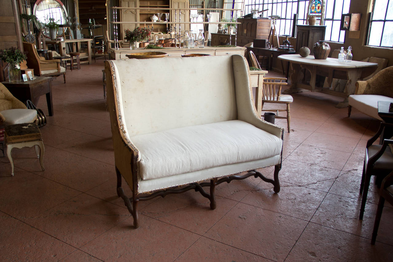 Vintage French os du mouton two-seat settee. Very solid and ready for your upholstery.