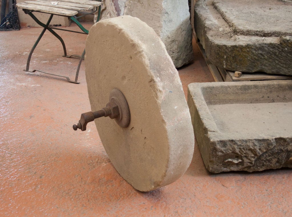 antique grinding wheel