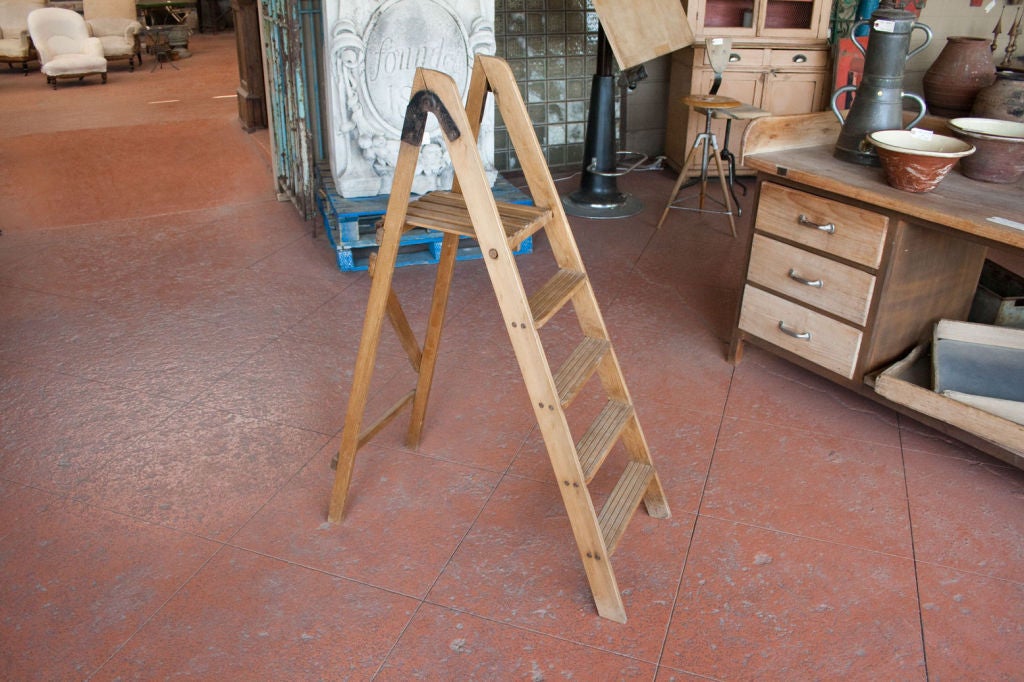 Vintage wooden step ladder with u-shaped hinges. Great display piece.