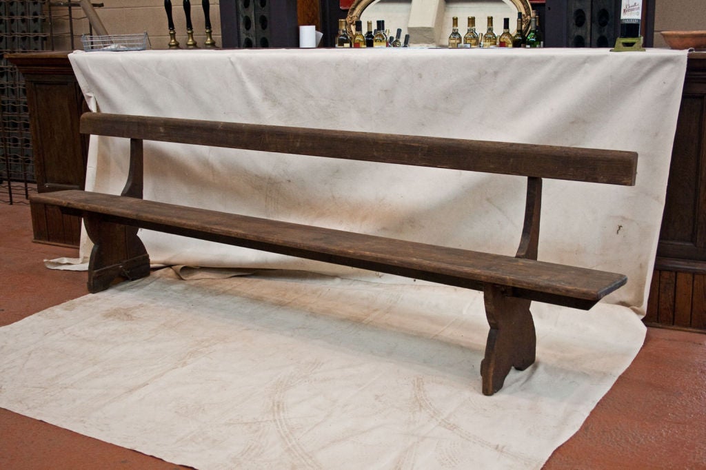 Lovely 100 year old wooden chapel bench with a single statted seat.  Works perfectly with long trestle dining table.