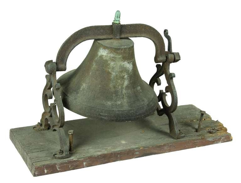 This bell was in a Greek Revival home in a cupola in the Framingham - Sudbury area of Massachusetts, 1830-1850. This bell is complete with supports and original mounting board and bolts. The mounting frame is stamped 