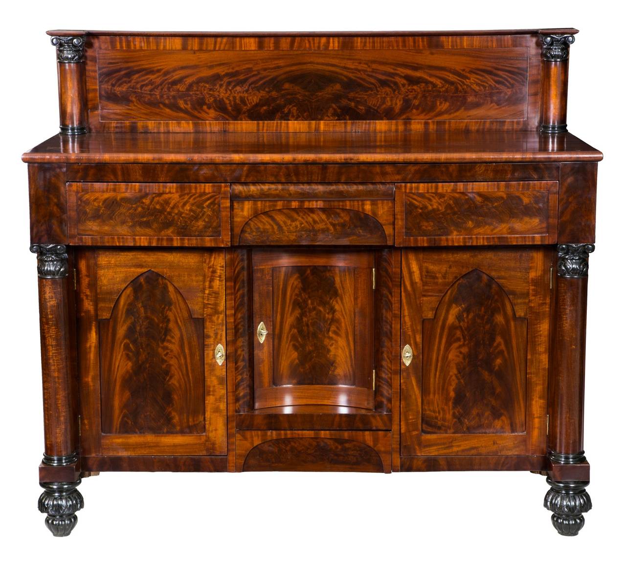 This is a moderately sized sideboard that is fully developed. Note that every section in the front opens to a cabinet or drawer. The figured mahogany is bookmatched on the backsplash and crossbanded with contrasting mahogany, all of which is flanked