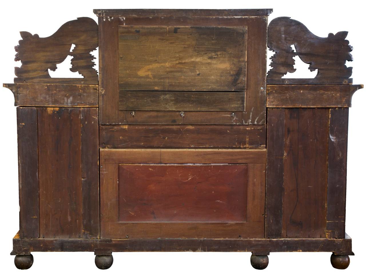 This sideboard form, for its time was fairly novel, appearing in the October 1822 issue of Ackerman’s Repository. The pyramidal doors open without suggestion of their being doors and the drawers above are architecturally developed within the cornice