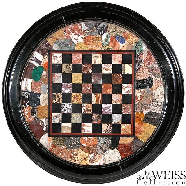 This table, which almost has a nautical look to it, is fitted with a magnificent marble top. Note, around the playing board, there are all different types of marble that are carefully fitted with one another. Because of this, this form is often