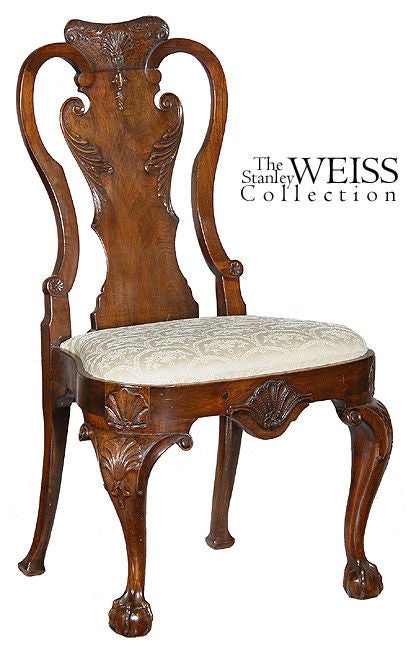 These chairs are of large-scale and employ all of the high style decorative elements of the Queen Anne period. Just about every meaningful element of this chair is carved: from the central crest rail, the back splat, and even small rosettes at the