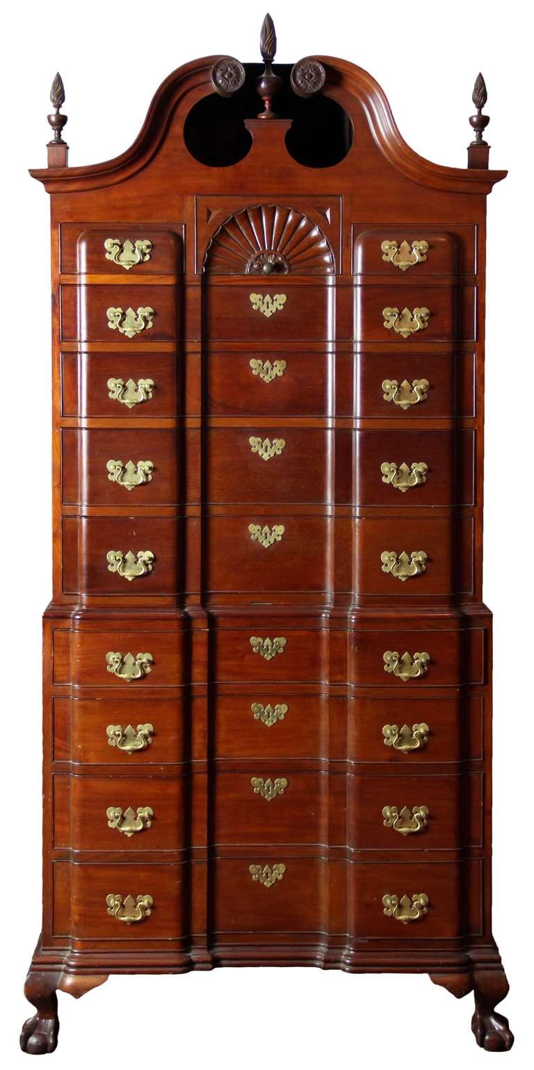 Constructed around the turn of the century, this chest on chest follows faithfully the great Boston block front furniture of the, late 18th century. It is all bench made, i.e. fully dovetailed and hand-carved. The wood is all of the solid and with