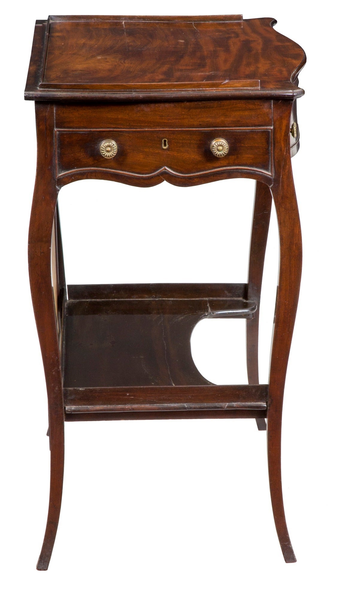 For a small compact piece, there’s a lot going on and of the finest quality, notably workmanship, style and choice of wood. At this point, there was a notable French influence in England and pieces of this type were being produced. This ladies