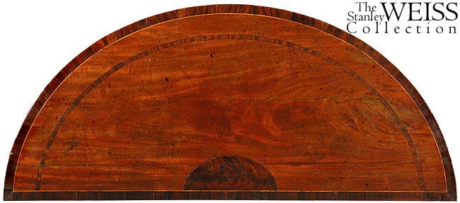 This is an English form rarely seen in America which is used as a side table, and can also be used as a server. This is a beautifully detailed piece with highly figured mahogany banded with satinwood. Of special note is the inlaid top, see below,