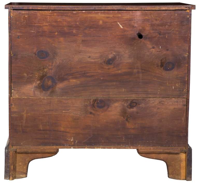 This tiger maple chest of small size (36 in. wide) has dramatic tiger maple drawer fronts with deep amber color that shows warmth that only occurs through many years. It has an old refinish and original brasses with a rarely seen nautical