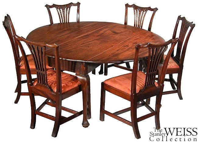 This is an outstanding table on the large-scale and composed of three solid unjoined boards, the top being one board, and each of the drop leaves, a single, large board. Also, the wood is extremely thick, making this a very heavy table. The legs are