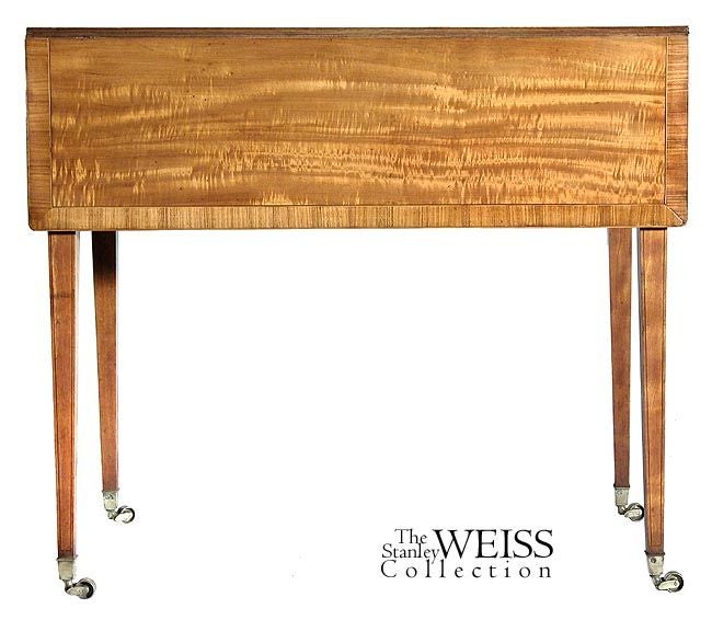 This is a small-scale Hepplewhite table with glorious satinwood throughout that has mellowed through the years. It is in superb condition with its original casters. The satinwood is embellished with line inlay on top and crossbanded at the edges