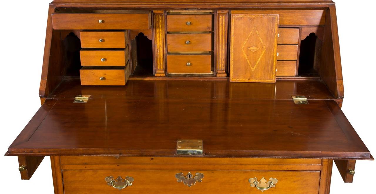 This is a first class desk and bookcase in superb condition and form with full secret interior. It has beautifully sculptured ogee bracket feet and not simple flat brackets, evidencing the quality and cost of construction. (This form of ogee foot