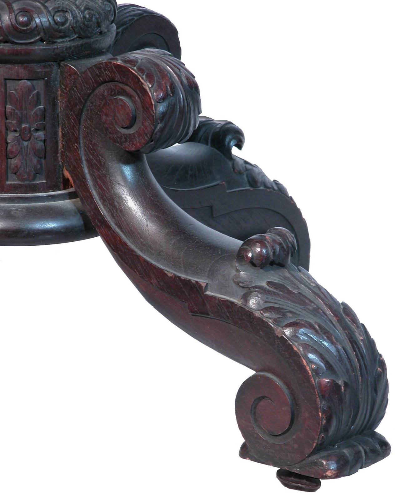 This is a phenomenal masterpiece. It is composed of dense heavy mahogany, and carved in a Masterly fashion. The eagles are finely sculpted, as are the dolphins, which are both classical motifs of the period. The sides of the Stand are further
