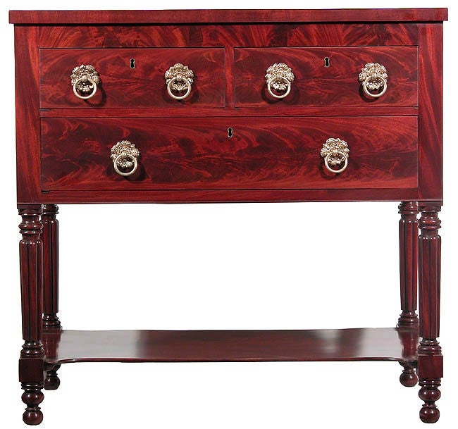 This is a striking server of small size featuring beautifully figured mahogany throughout. We attribute this piece to Baltimore on the basis of its reeded legs. This table was obviously treasured and used very carefully through the years and has