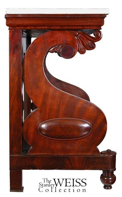 This pier table is composed of richly figured mahogany and has a very sculptural profile which greatly reduces the weightiness of the table. Indeed, the two supports are beautifully scrolled cyma curves which terminate in a series of small, highly