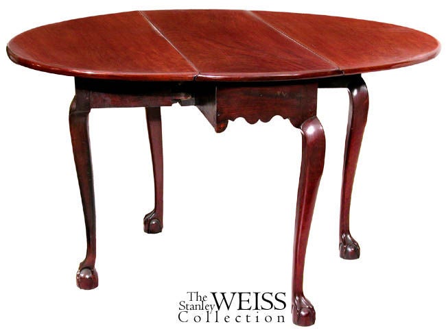 This table has classic Salem claw and ball feet with the break at the knee typical of this school of cabinetmakers producing furniture there at the time. The top is heavy single board Santo Domingo mahogany that has been overlaid and French