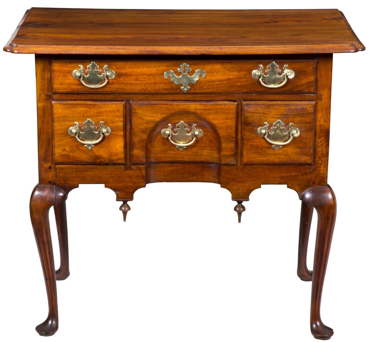 This lowboy has a very large overhang, which is a most desirable feature for this form, and the corners are beautifully pinched and molded. The entire piece, including the top, has striped walnut with beautiful graining and warm color that is the