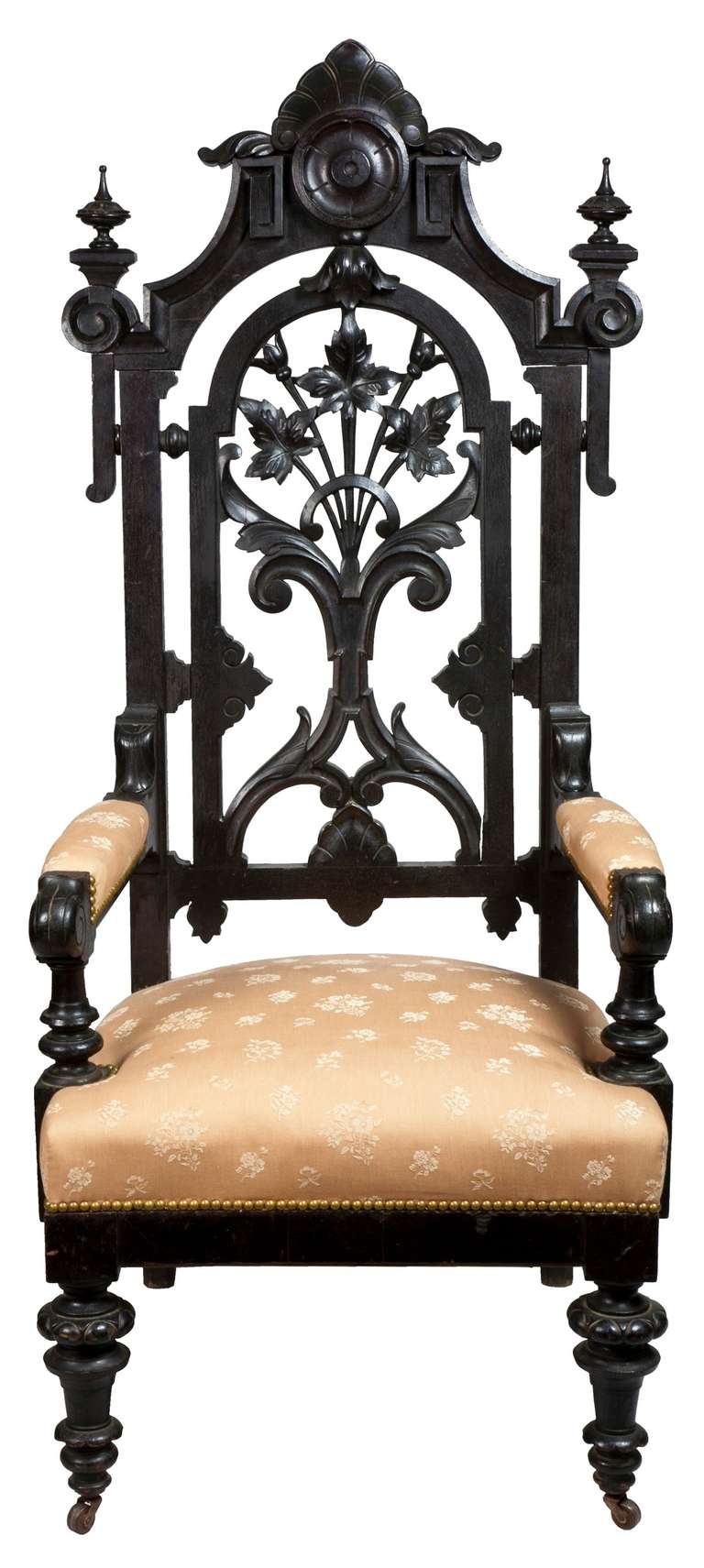 A monumental ebonized Renaissance Revival Baltimore armchair, circa 1860. This masterful armchair is a tour de force of carved and turned elements, the back of this chair is reminiscent of the later Art Nouveau style during this century. The finials