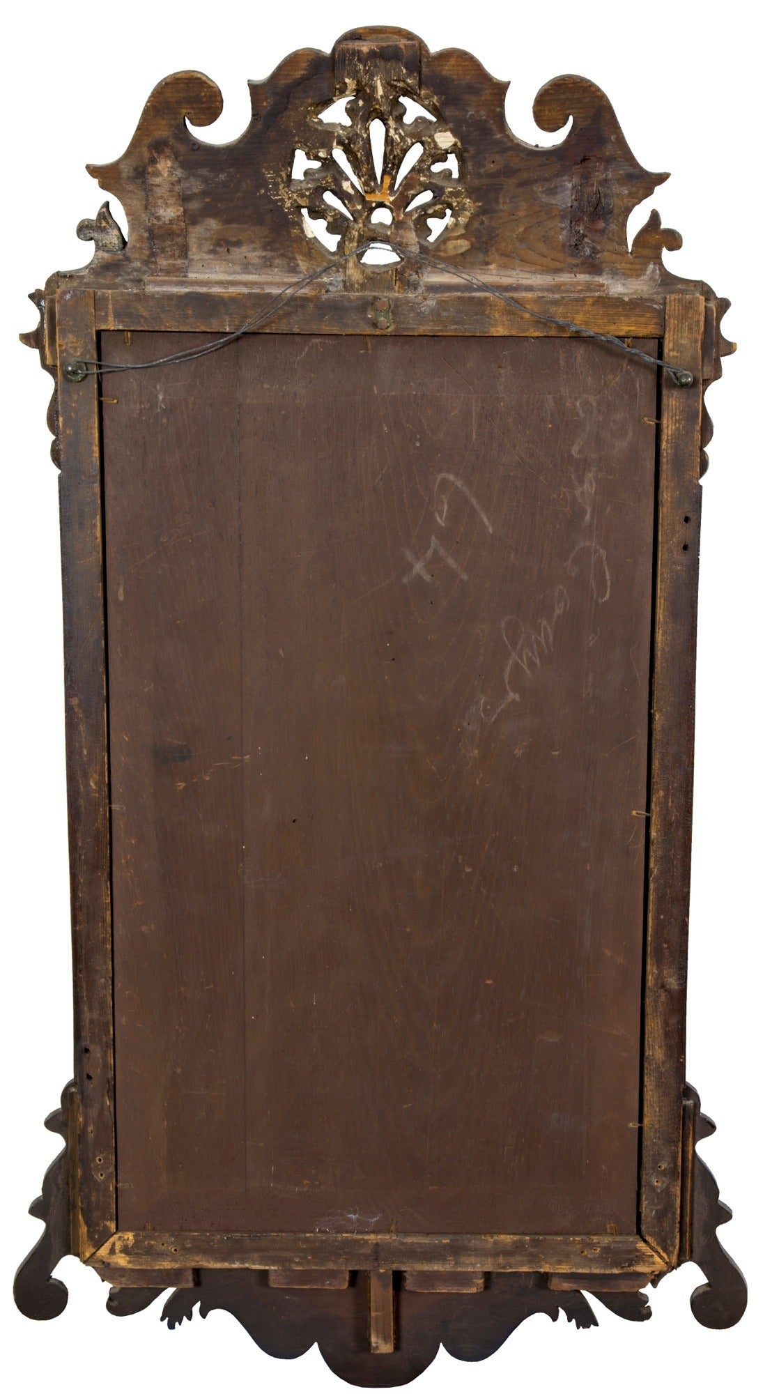 This is a very compelling mirror of great depth and beauty. It is of mid-size. The walnut has a rich, old tone with shrinkage cracks running up and down its gilt border. If the wood is of the period, than this is what to expect, and one test of