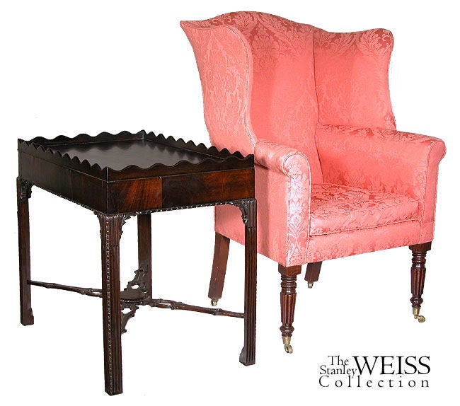 This dark mahogany tea table is of large serviceable size and works very nicely in front of a sofa or chairs. This tea table with scalloped edge has a very delicate carved molding below the apron, which is where the carved embellishment begins. The