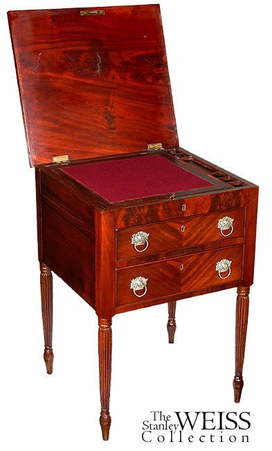 This work table of good size is composed of highly figured mahogany. The top is of the solid (see detail), where most tables of this type are found with veneered tops and is also reeded on its edge, which complements the legs. The top is a fabulous