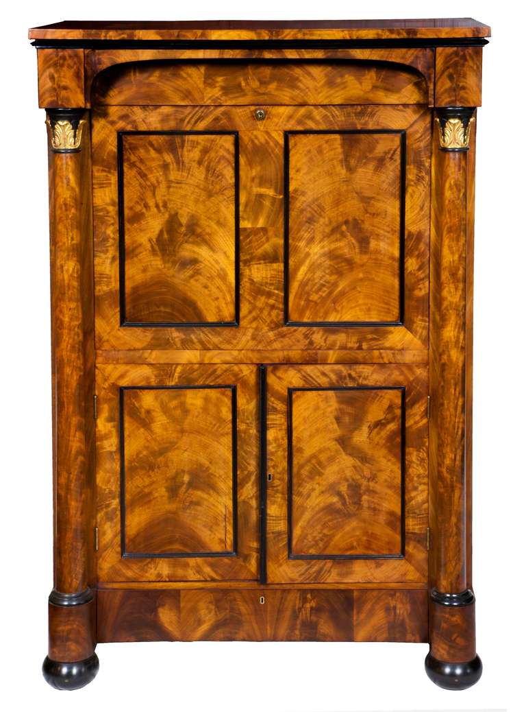 This was a remarkably untouched piece of furniture, which has been French polished and cleaned with its original leather writing surface. Boston models were fairly austere, and this one relies on its beautifully figured columns with gilt acanthus