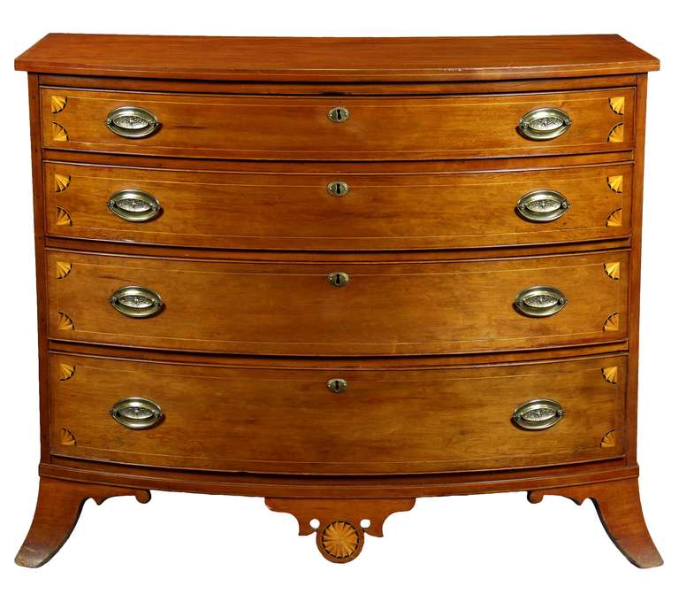 This chest is an outstanding example of Connecticut exuberance and makes a dramatic statement in any room. Note the magnificent drop pendant. They don't come any better in the world of inlaid furniture. The feet also make an outstanding statement by