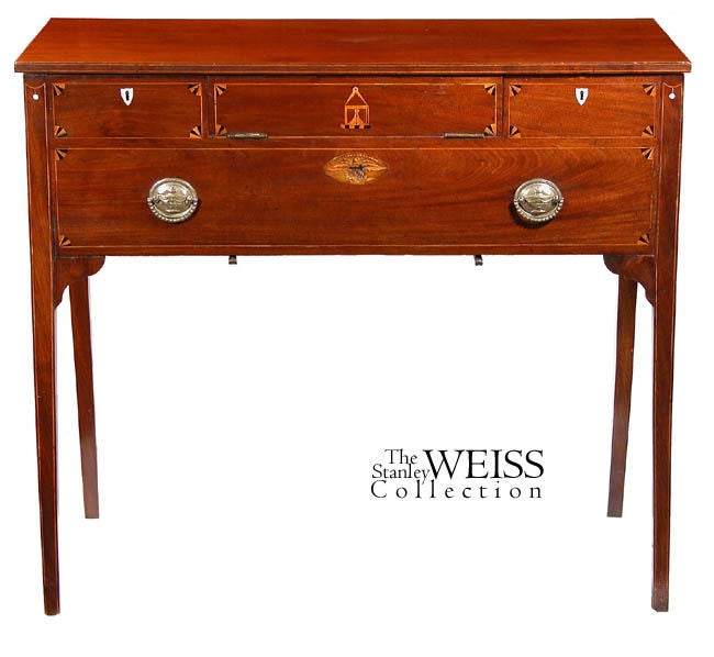 This is an intriguing desk with a number of interesting features. Before going into the mechanics, one should note that it almost has a server's height, and is quite functional in that mode. The edges of the top are line-inlaid with satinwood, as