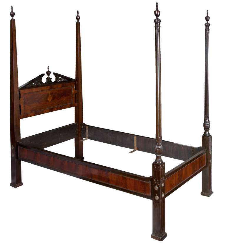 This extraordinary pair of beds has classic cluster column posts and carved embellishments which effectively tie the clusters together.  These beds illustrate a well-executed design composition with commensurate craftsmanship of the highest quality.