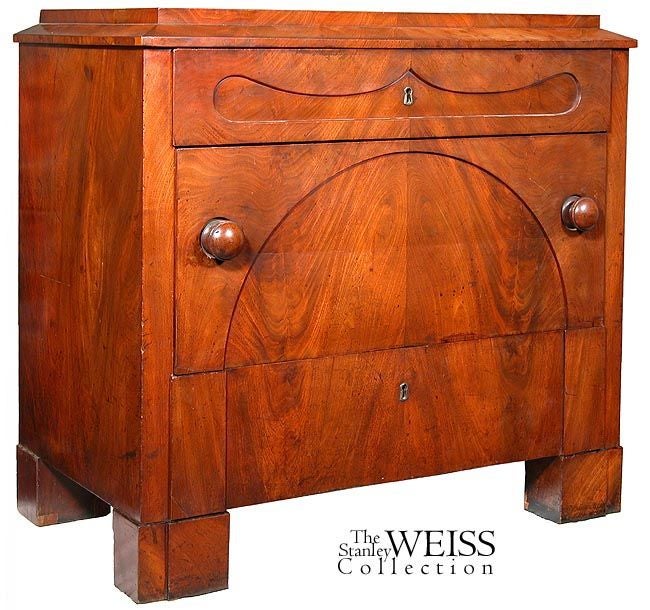 This Biedermeier chest is very compact, only 34 in. wide and 19 in. deep; being 34 in. wide, it can easily go alongside a bed, or a couch in a living room, with lamp, etc. Not only is it very decorative in a restrained manner with an arched main