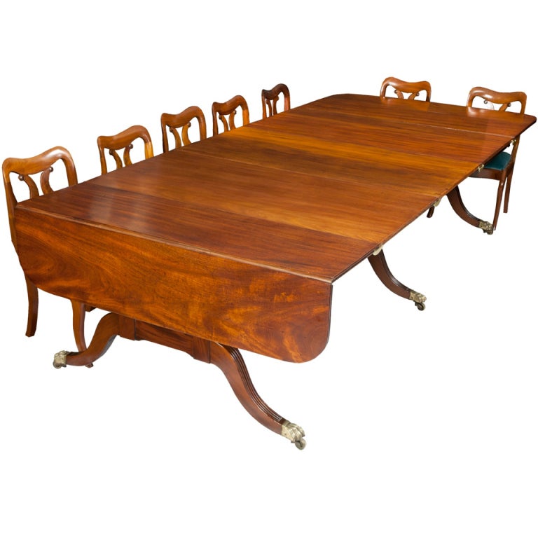 Banquet tables are far rarer than dining room tables, as there are more parts that get lost over time, and generally fewer were ever made. This is a superb example with magnificent Cuban mahogany leaves, which are all of the solid. 

The design of