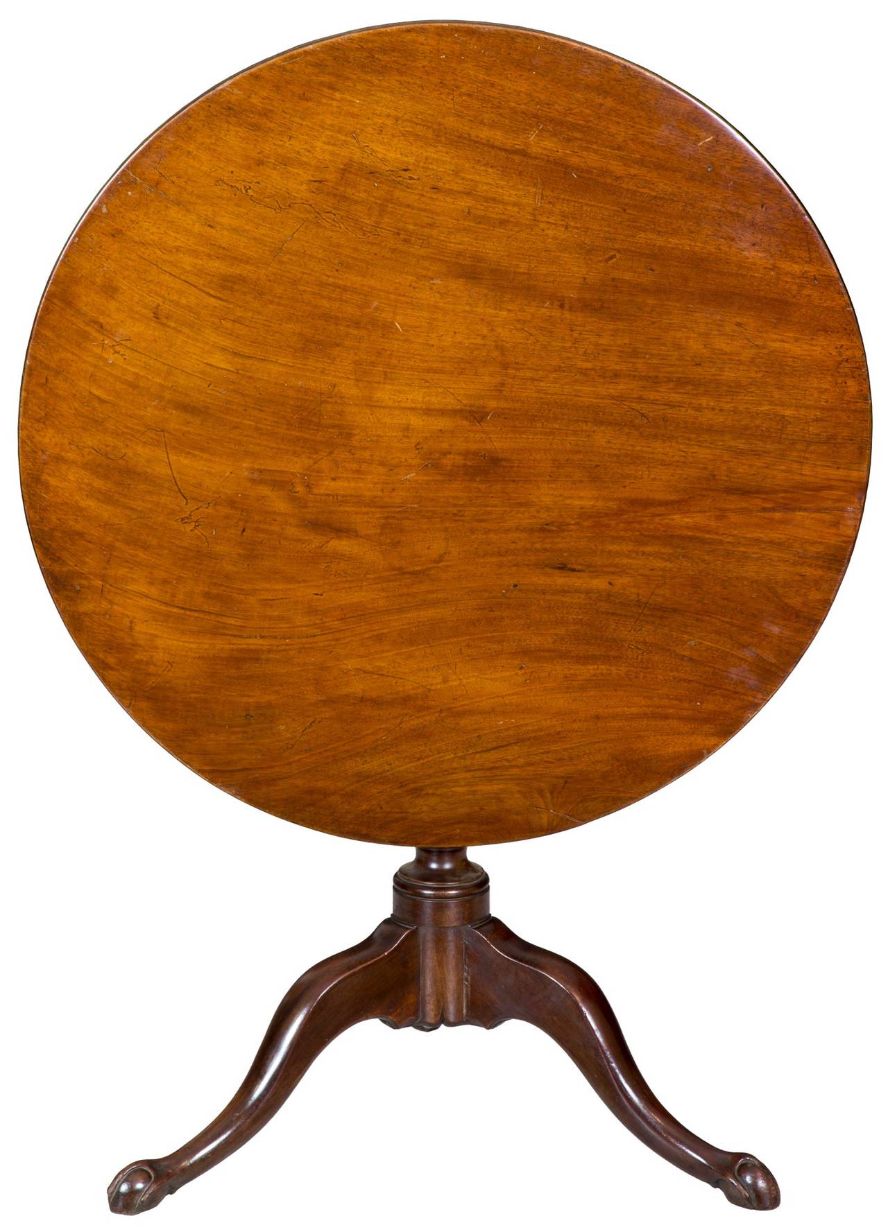 A Chippendale mahogany tilt-top table with small claw and ball feet and spiral carved column, Newport, circa 1780.

This is a very beautiful table in many respects. The top of the table itself is a beautiful slab of dense, heavy Cuban mahogany.