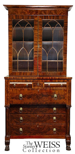 This monumental secretary is composed of highly figured radiant mahogany worthy of the secretaries currently on exhibit in the Metropolitan museum Americana or Classical Wing, with traditional Empire columns with carved capitals and acanthus carved