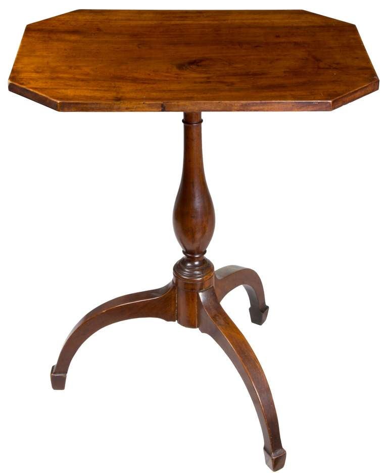 The mahogany on the top is of a solid board of strongly figure Santo Domingo mahogany. While the baluster is slender, the legs are somewhat nautical in appearance. The weight is quite heavy, given the dense mahogany used throughout. No major