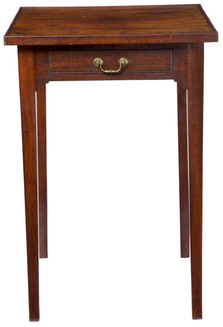 A Rare Hepplewhite (Federal) Mahogany 1 Drawer Stand with carved Tray Top, probably Newport, late 18th century
 
This is a very rare form given the carved tray top. The mode of construction, i.e. the one-piece apron surrounding the drawer, is a