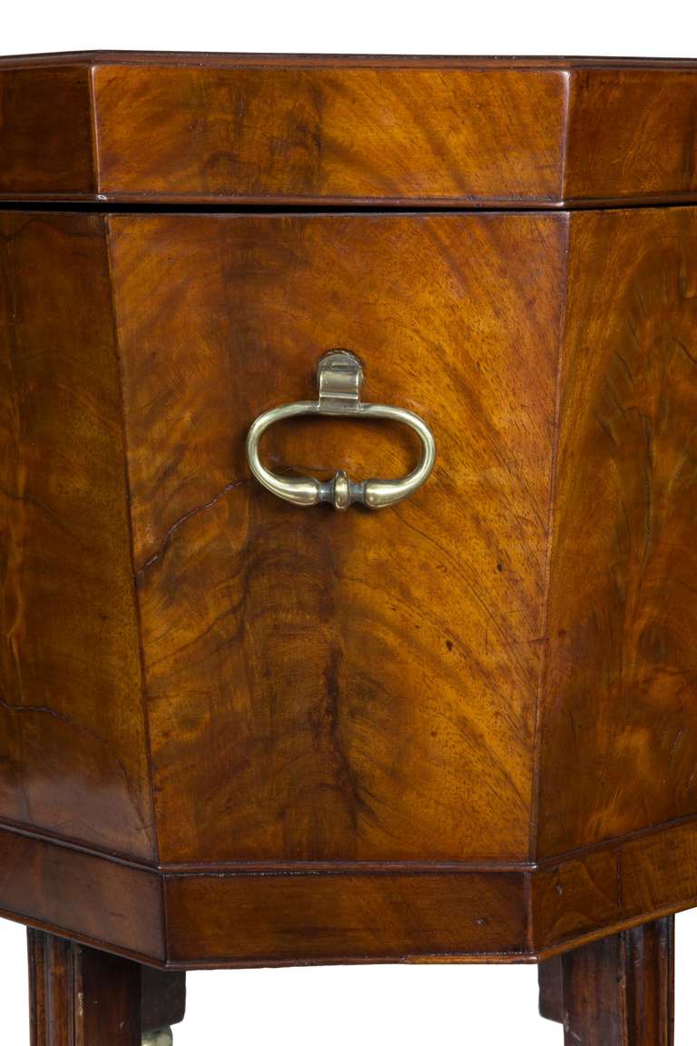 Each side of this cellarette is composed of heavy mahogany veneers, showing its fabulous striped mahogany panels which over time have deepened into a mellow yellow/red color of great depth. The same is true of the top. (See details.) Everything is